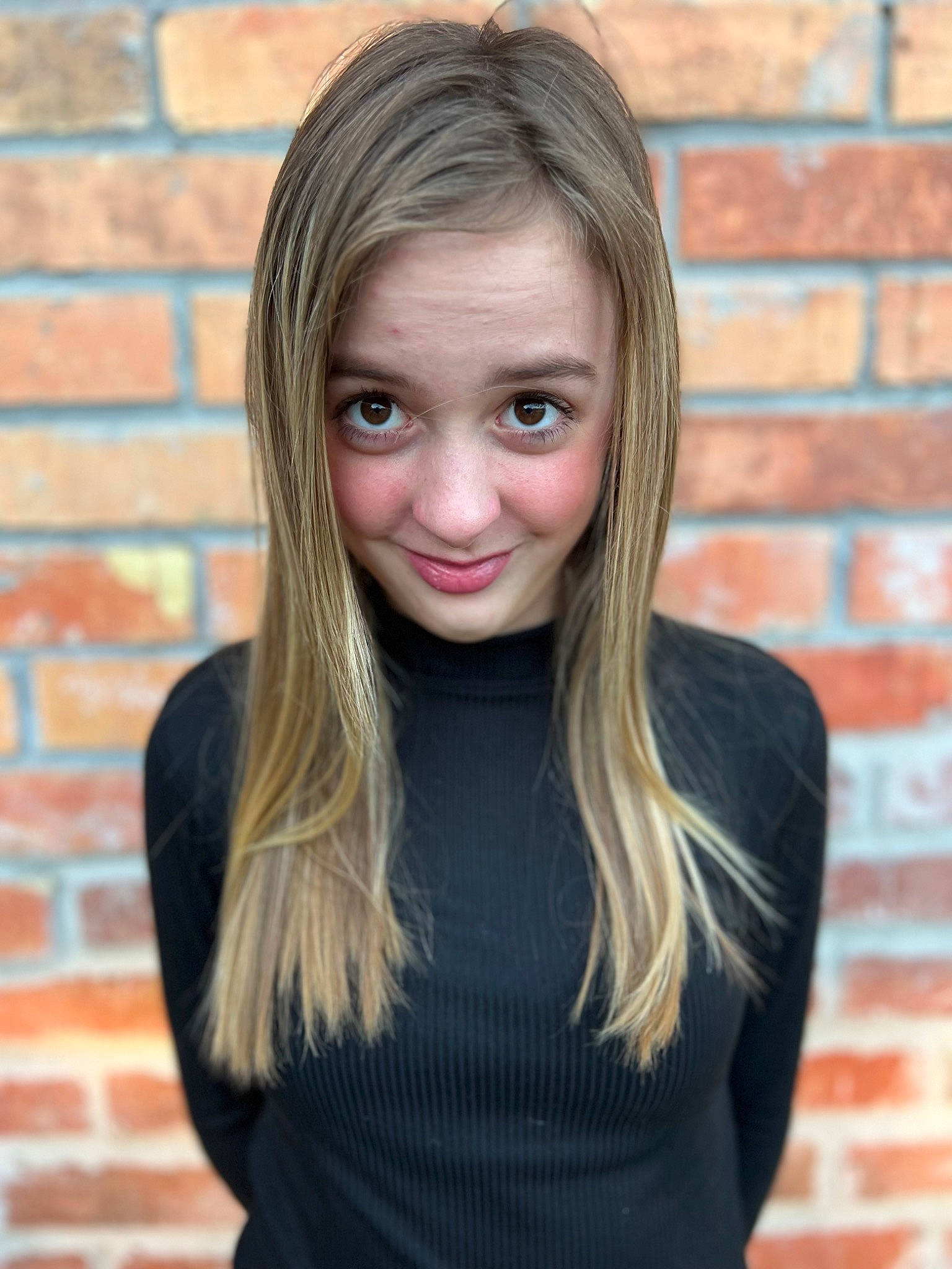 Bethany joined the competition — help win amazing prizes! black_hair, brick, brickwork, cheek, eyebrow, eyelash, face, flash_photography, hair, happy, head, iris, jaw, joy, layered_hair, lip, neck, nose, organ, person