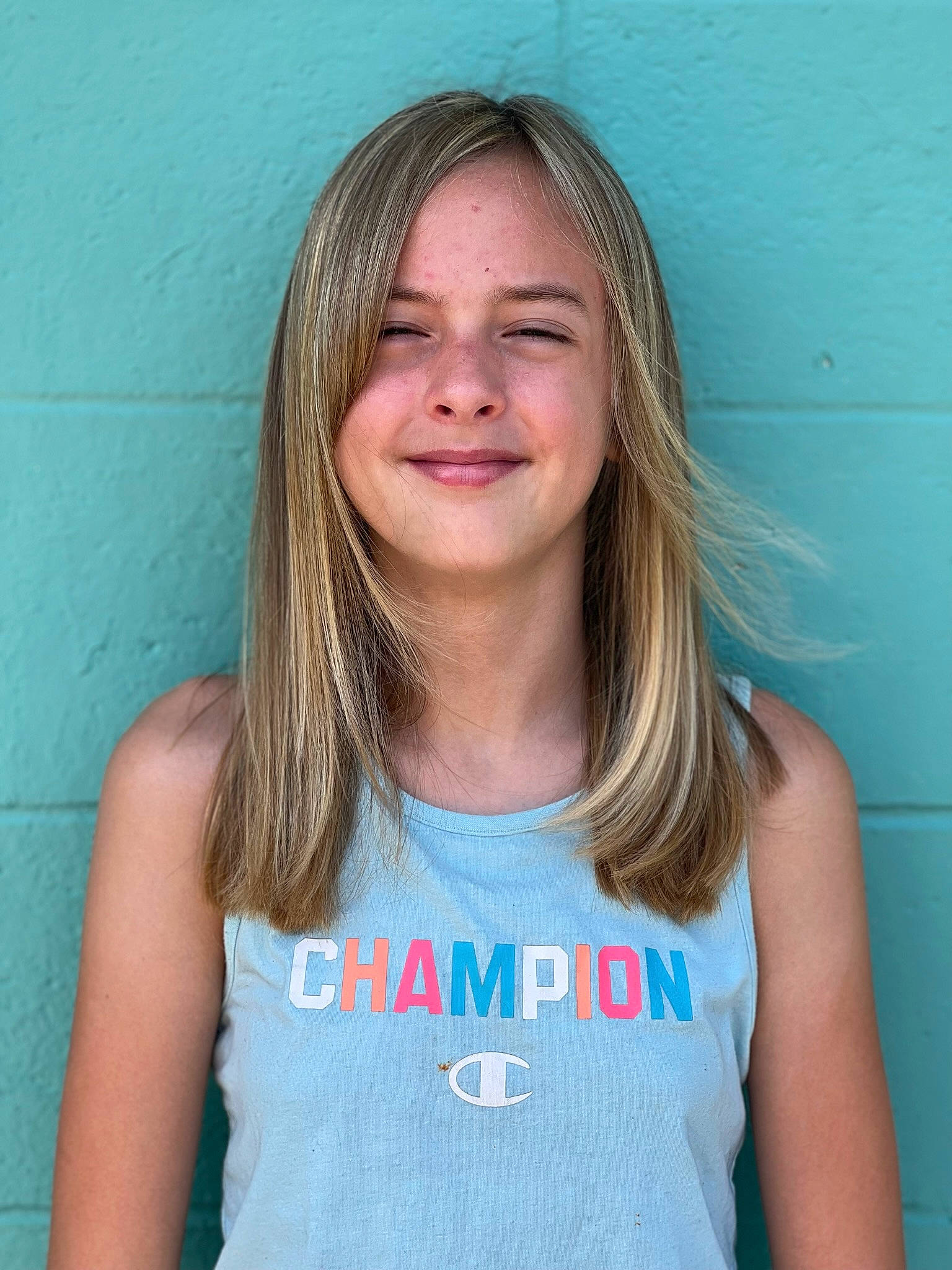 Bethany is registered to the contest to win money with this photo: active_tank, azure, cheek, chin, eyebrow, eyelash, gesture, hair, happy, head, human_body, jaw, joint, joy, lip, mouth, neck, person, shoulder, skin