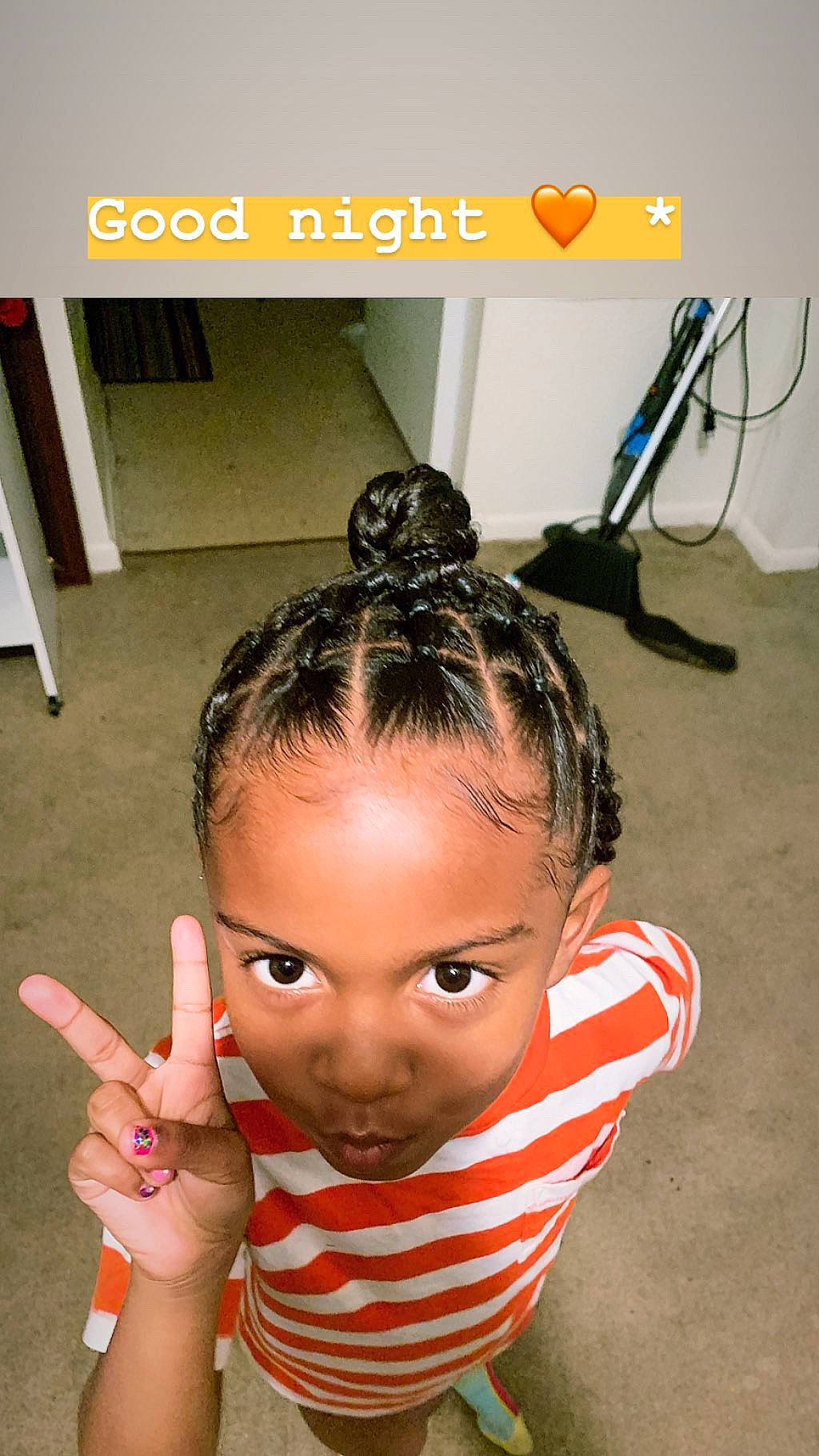 Koko is registered to the contest to win money with this photo: black_hair, braid, child, cornrows, ear, finger, forehead, hair, hairstyle, hand, head, person, photo_caption, pigtail, toddler