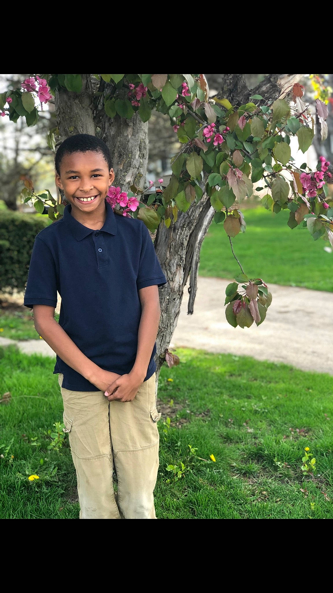 Deandre is registered to the contest to win money with this photo: adaptation, botany, branch, flower, grass, joy, lawn, person, photography, plant, smile, tree