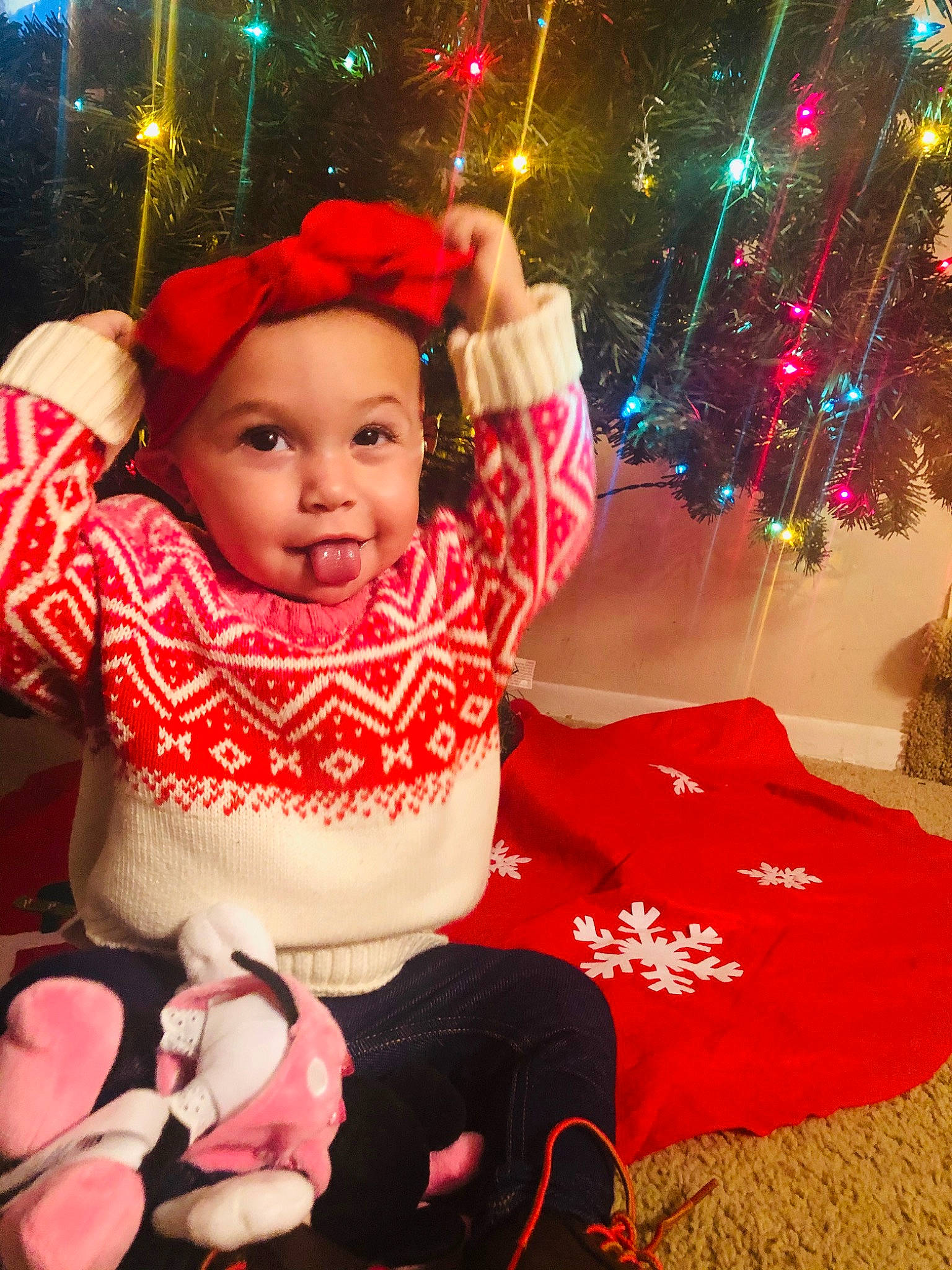 Skylar joined the competition — help win amazing prizes! child, christmas, christmas_decoration, christmas_eve, christmas_lights, christmas_ornament, christmas_tree, event, fun, happy, head, headwear, holiday, interior_design, ornament, person, pink, smile, toddler, tradition