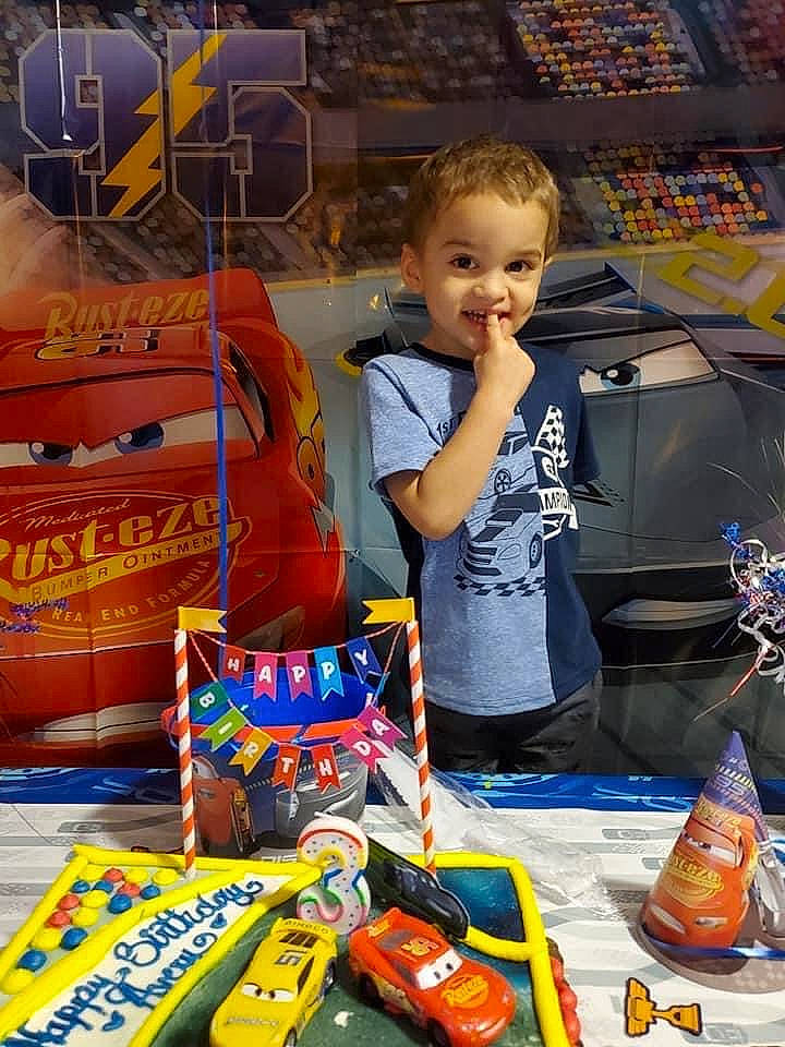 Avery is registered to the contest to win money with this photo: child, event, fun, games, joy, junk_food, leisure, orange, person, plastic, play, recreation, smile, t_shirt, toddler, toy, toy_vehicle, travel, vacation, watercraft