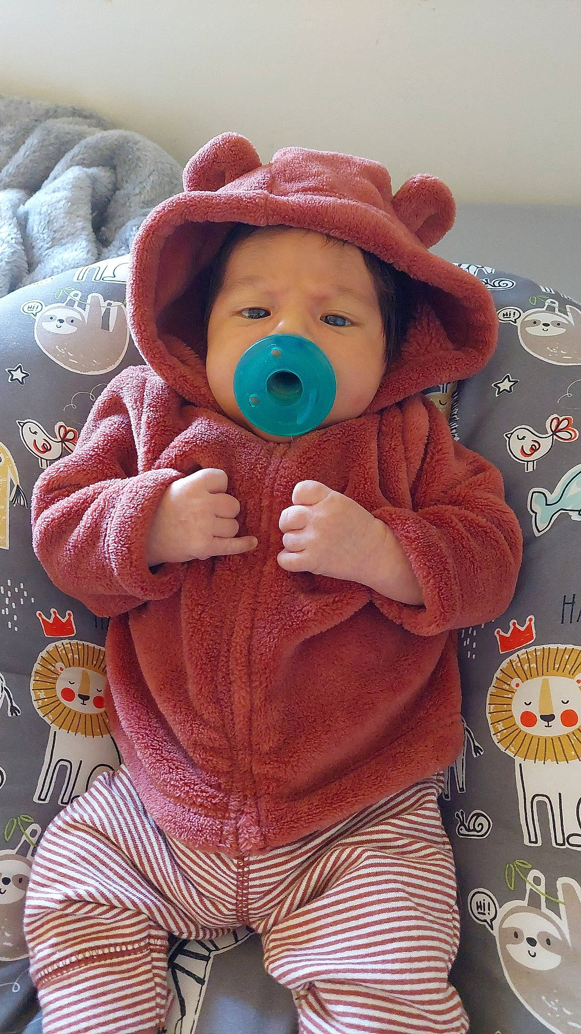 Zion is registered to the contest to win money with this photo: baby, baby_sleeping, baby_toddler_clothing, cap, cheek, child, comfort, happy, hat, jacket, outerwear, pattern, person, pink, skin, sleeve, stuffed_toy, sun_hat, textile, toddler