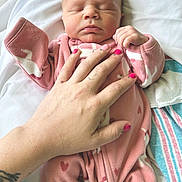 Paisley is registered to the contest to win money with this photo: baby, bed, blanket, cozy, cute, fingers, hand, infant, nail_polish, newborn, peaceful, person, pink_outfit, portrait, resting, skin, sleeping, soft, tattoo, warm