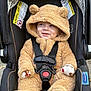 baby, car_seat, child, cute, fuzzy_clothing, hood, infant, mammal_costume, outdoor, person, plush, seatbelt, smile, toddler, transportation, warm_clothing, wearing, young_child, zipper, cute_outfit