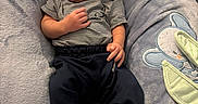 Jermoni is registered to the contest to win money with this photo: baby, infant, blanket, clothing, striped_shirt, blue_pants, white_socks, soft_texture, plush, embroidery, mouse_design, lying_down, curious_expression, indoors, closeup, newborn, baby_bedding, child, cute, portrait