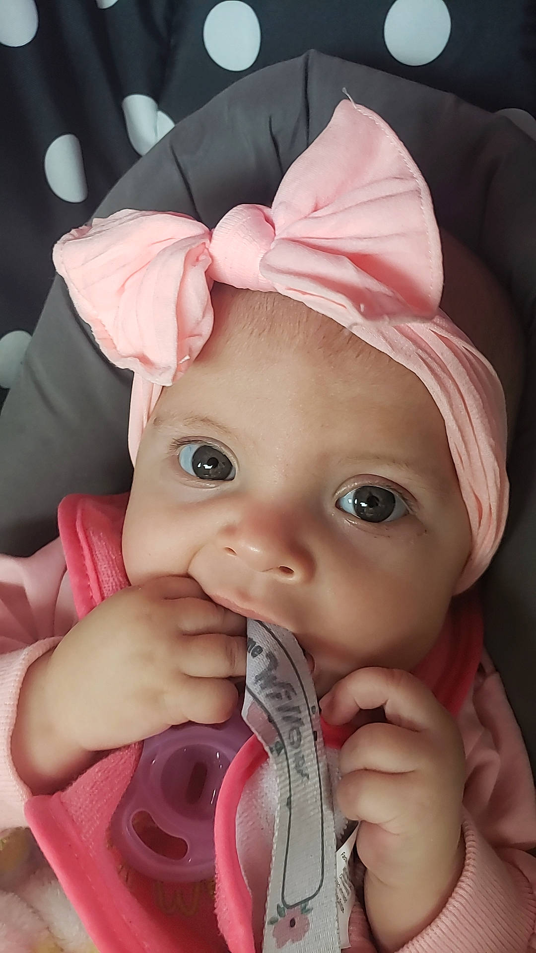 Willow joined the competition — help win amazing prizes! baby, baby_toddler_clothing, cap, cheek, dress, drinkware, eyebrow, eyelash, facial_expression, finger, gesture, hand, headwear, lip, mouth, nail, nose, person, pink, skin