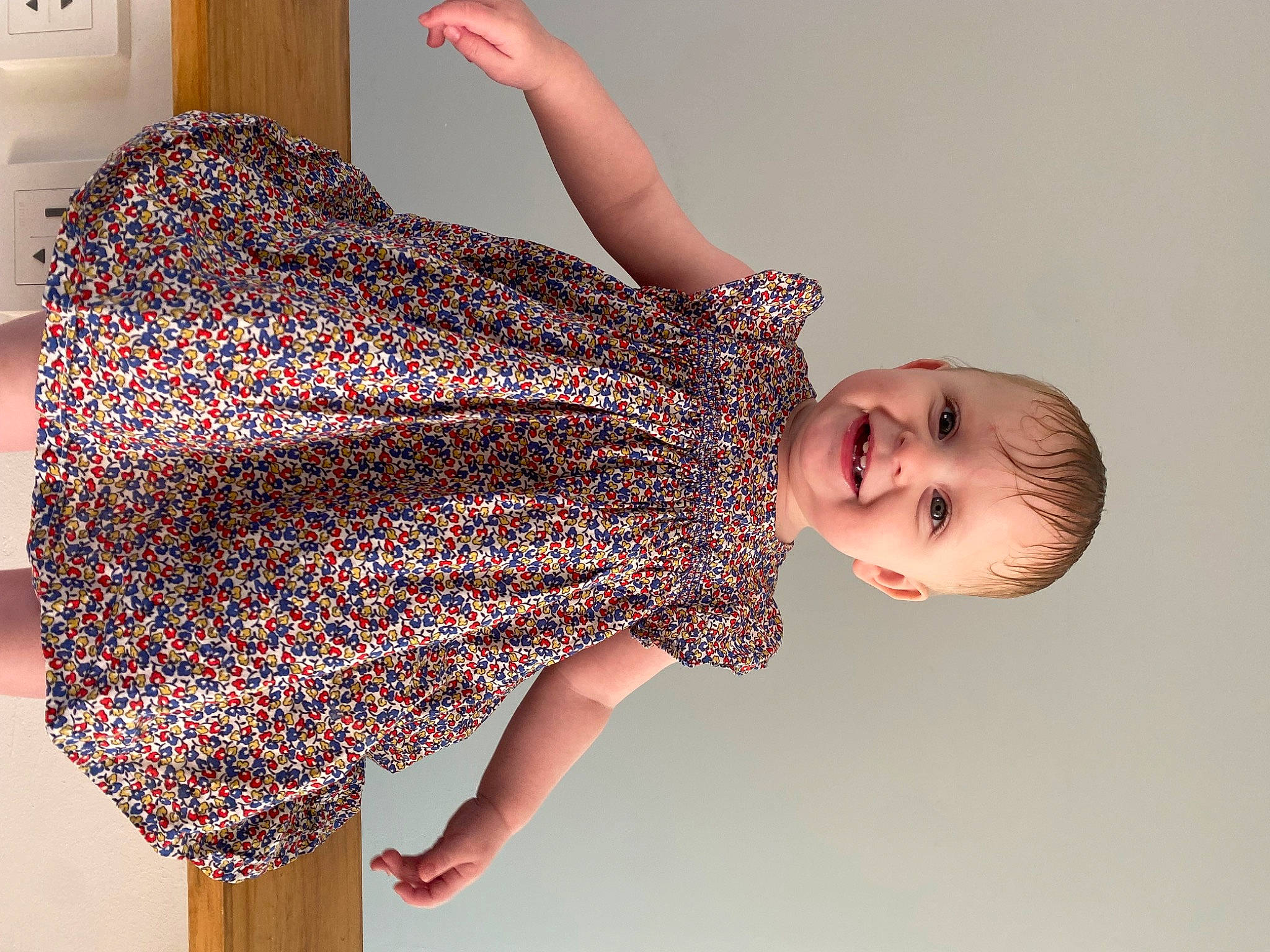 Chelsea participe au concours pour gagner de l'argent avec cette photo : baby_toddler_clothing, creative_arts, elbow, fashion_design, gesture, hand, happy, human_leg, joint, joy, magenta, neck, one_piece_garment, pattern, person, shoulder, sleeve, smile, textile, toddler