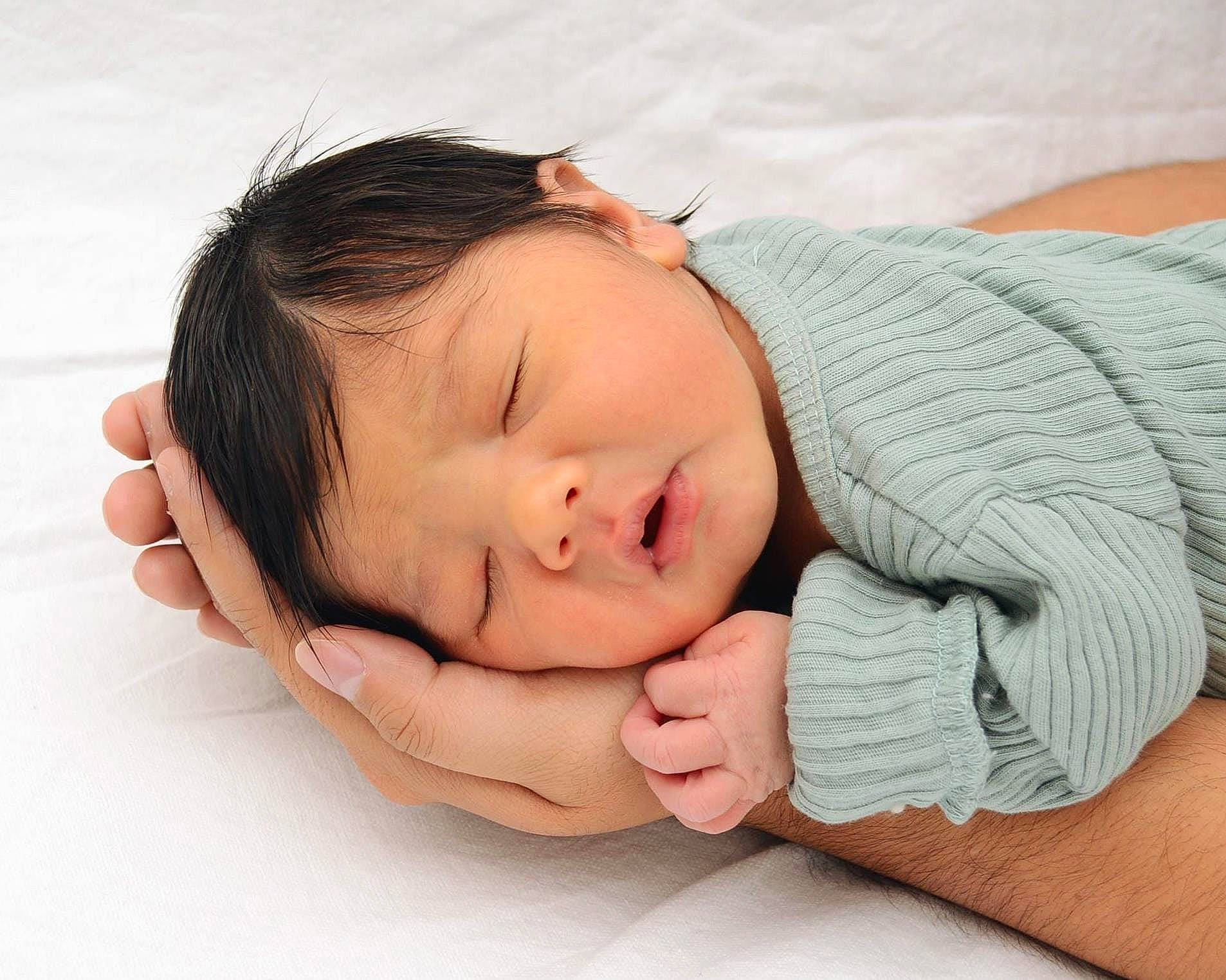Cooper is registered to the contest to win money with this photo: baby, baby_sleeping, baby_toddler_clothing, cheek, comfort, elbow, eyelash, face, gesture, hand, happy, head, human_body, linens, nail, nose, person, sleeve, thumb, toddler