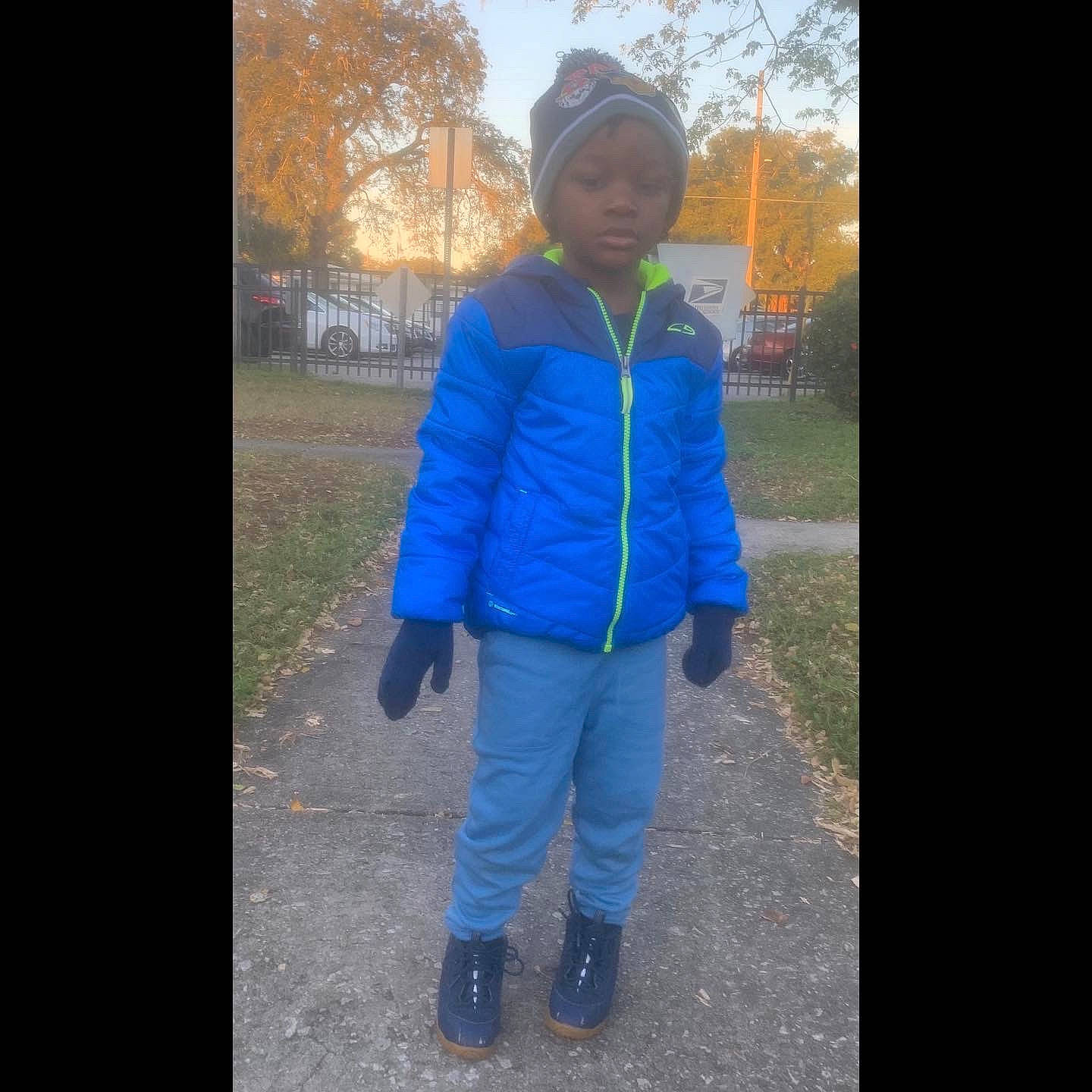 Anthony is registered to the contest to win money with this photo: cap, cool, denim, electric_blue, fashion_accessory, freezing, grass, happy, headwear, hood, human_leg, jacket, leisure, outerwear, person, recreation, sky, sleeve, standing, street_fashion