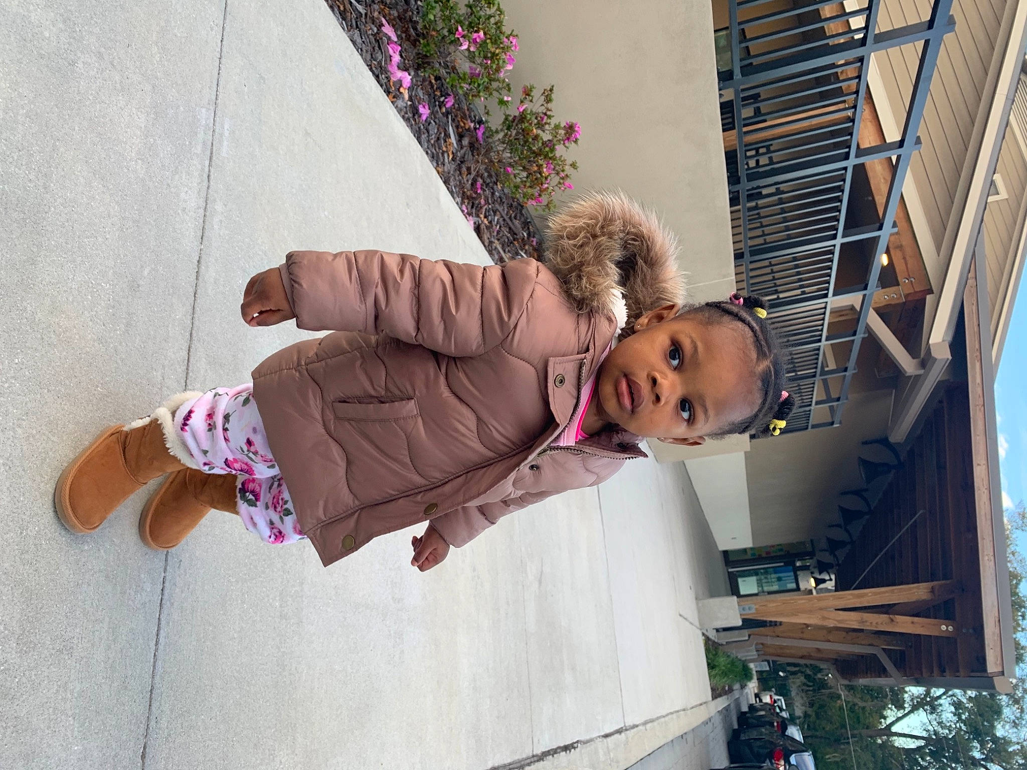 Ashari is registered to the contest to win money with this photo: building, child, fun, happy, house, human_leg, leisure, magenta, person, pink, plant, purple, sitting, sky, sock, street_fashion, thigh, toddler, tree, vacation