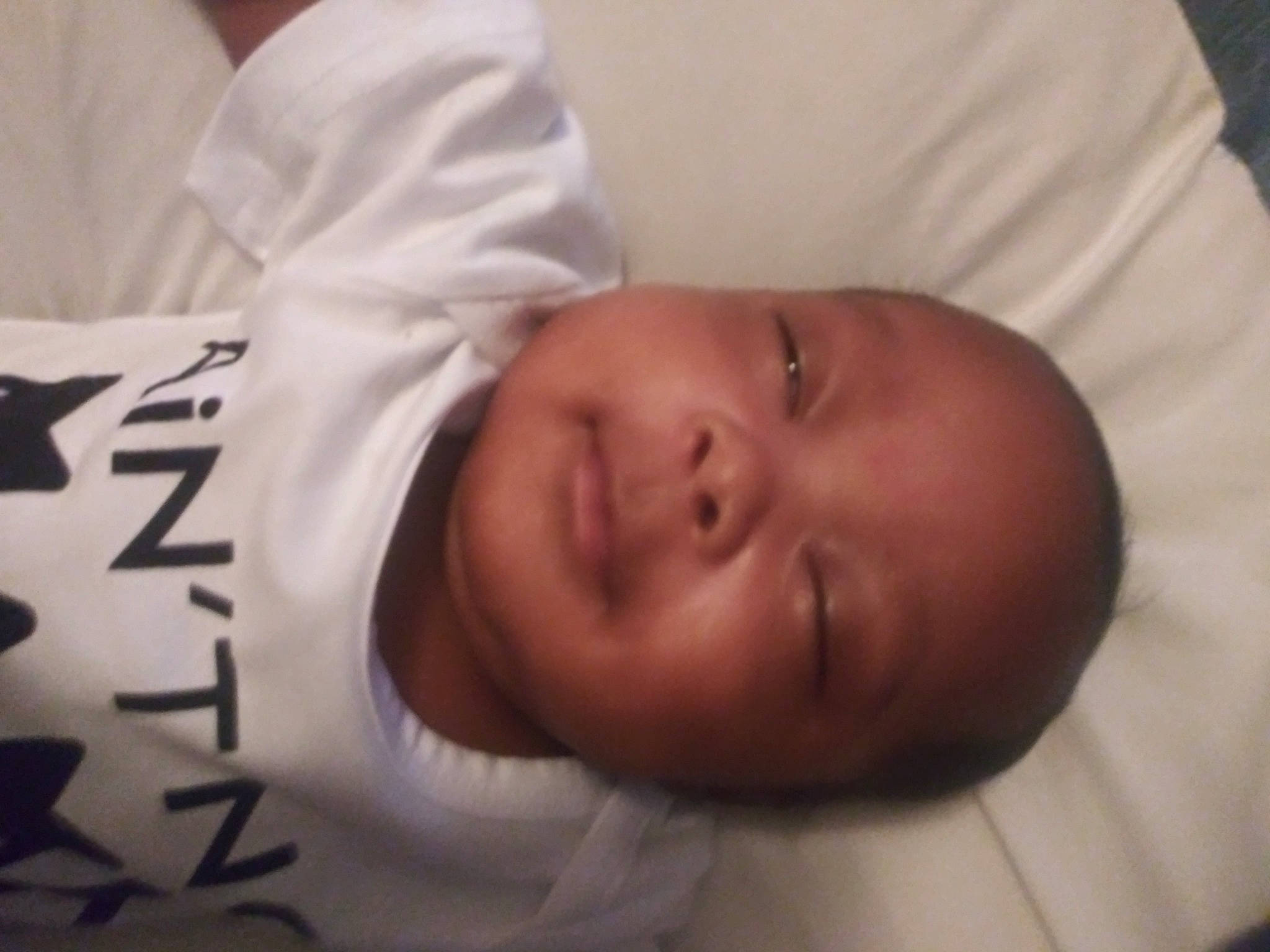 Jermaine is registered to the contest to win money with this photo: baby, baby_products, baby_sleeping, baby_toddler_clothing, bedtime, cheek, child, comfort, ear, eyebrow, linens, nap, nose, person, room, sleep, smile, toddler
