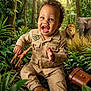 Makenai joined the competition — help win amazing prizes! baby, binoculars_case, child, curly_hair, elephant, explorer, giraffe_toy, greenery, happy, jungle, lion, outdoor, playful, portrait, safari_outfit, sitting, smiling, toddler, tropical_forest, vegetation