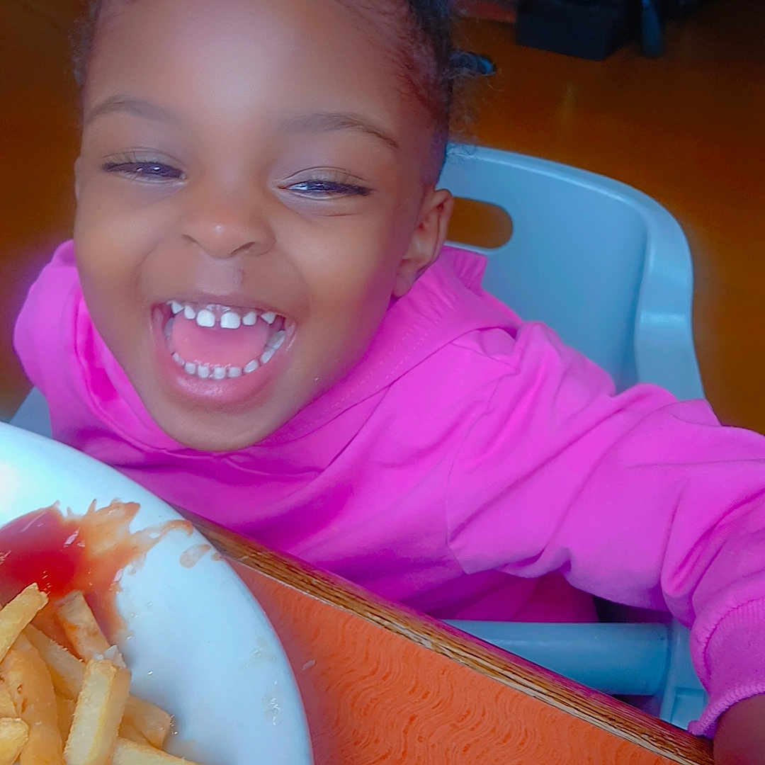 Kloey joined the competition — help win amazing prizes! casual, child, face, food, french_fries, hand, happy, high_chair, indoor, joyful, ketchup, laughing, meal, person, pink_hoodie, plate, seat, smiling, table, young