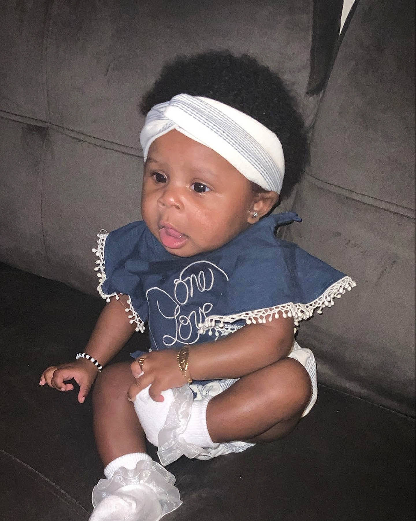 Kaliah joined the competition — help win amazing prizes! baby, baby_toddler_clothing, beanie, cap, child, costume_hat, electric_blue, fashion_accessory, flash_photography, fun, hat, headwear, human_leg, knee, magenta, person, sitting, sleeve, sock, t_shirt