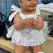 Melodie a rejoint le concours — aidez-le/la à gagner de superbes lots ! baby, bench, bow, child, clothing_store, cute, dress, fashion, girl, handbag, headband, indoor, jeans, portrait, retail, sitting, smile, socks, white_dress, white_socks