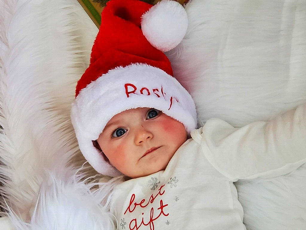 Roslyn joined the competition — help win amazing prizes! baby, baby_sleeping, baby_toddler_clothing, cap, child, comfort, costume_hat, event, fashion_accessory, fictional_character, fur, fur_clothing, happy, head, headgear, headwear, person, portrait_photography, santa_claus, sleeve