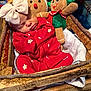 baby, blanket, child, christmas, cozy, cute, decor, festive, gingerbread_doll, holiday_theme, indoors, infant, peaceful, pink_bow, plush_doll, red_pajamas, sleeping, smiling_doll, soft_toys, wooden_basket