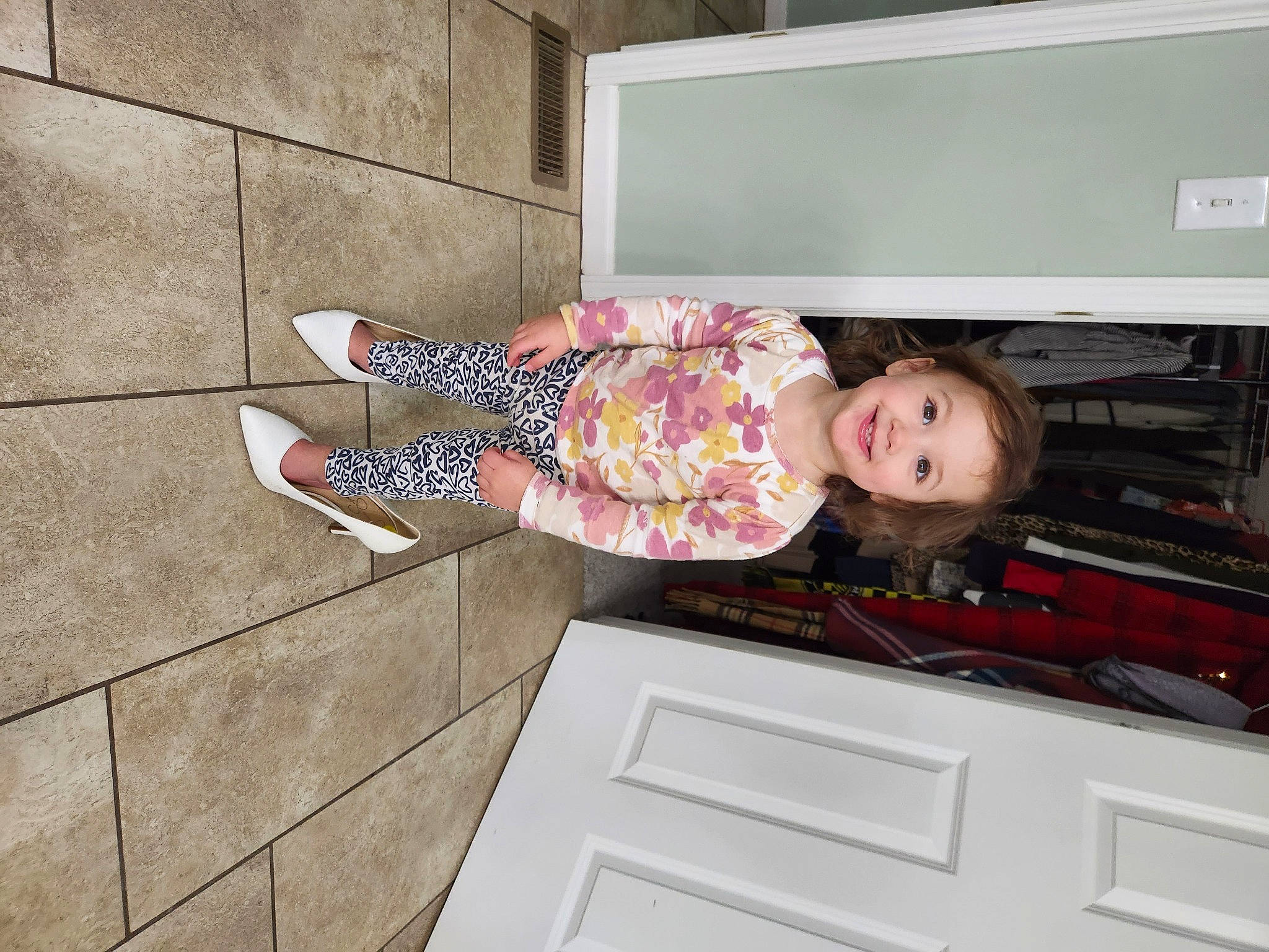 Sofia is registered to the contest to win money with this photo: baby_toddler_clothing, child, drawer, flooring, fun, happy, hat, home_appliance, human_leg, joy, magenta, pattern, person, pink, room, sandal, smile, television, thigh, toddler