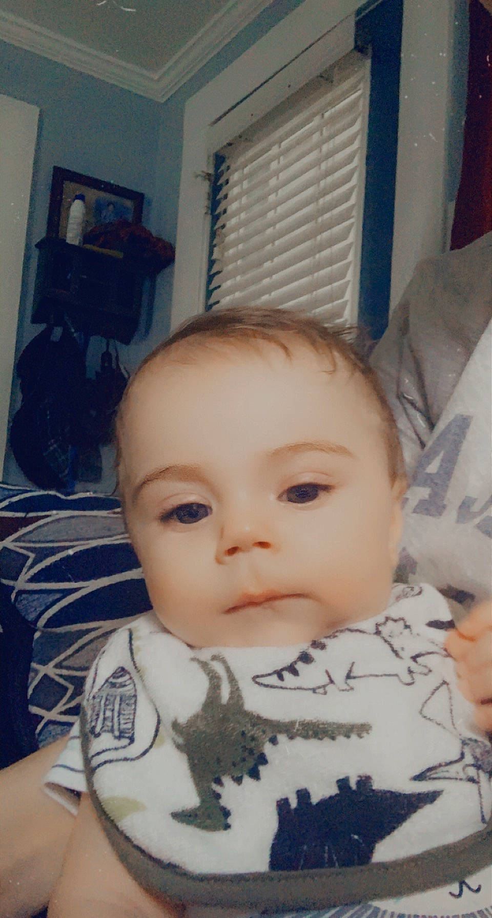 Carter is registered to the contest to win money with this photo: baby, baby_toddler_clothing, cheek, child, chin, ear, eye, eyebrow, eyelash, forehead, iris, lip, mouth, no_expression, nose, person, selfie, sitting, skin, toddler
