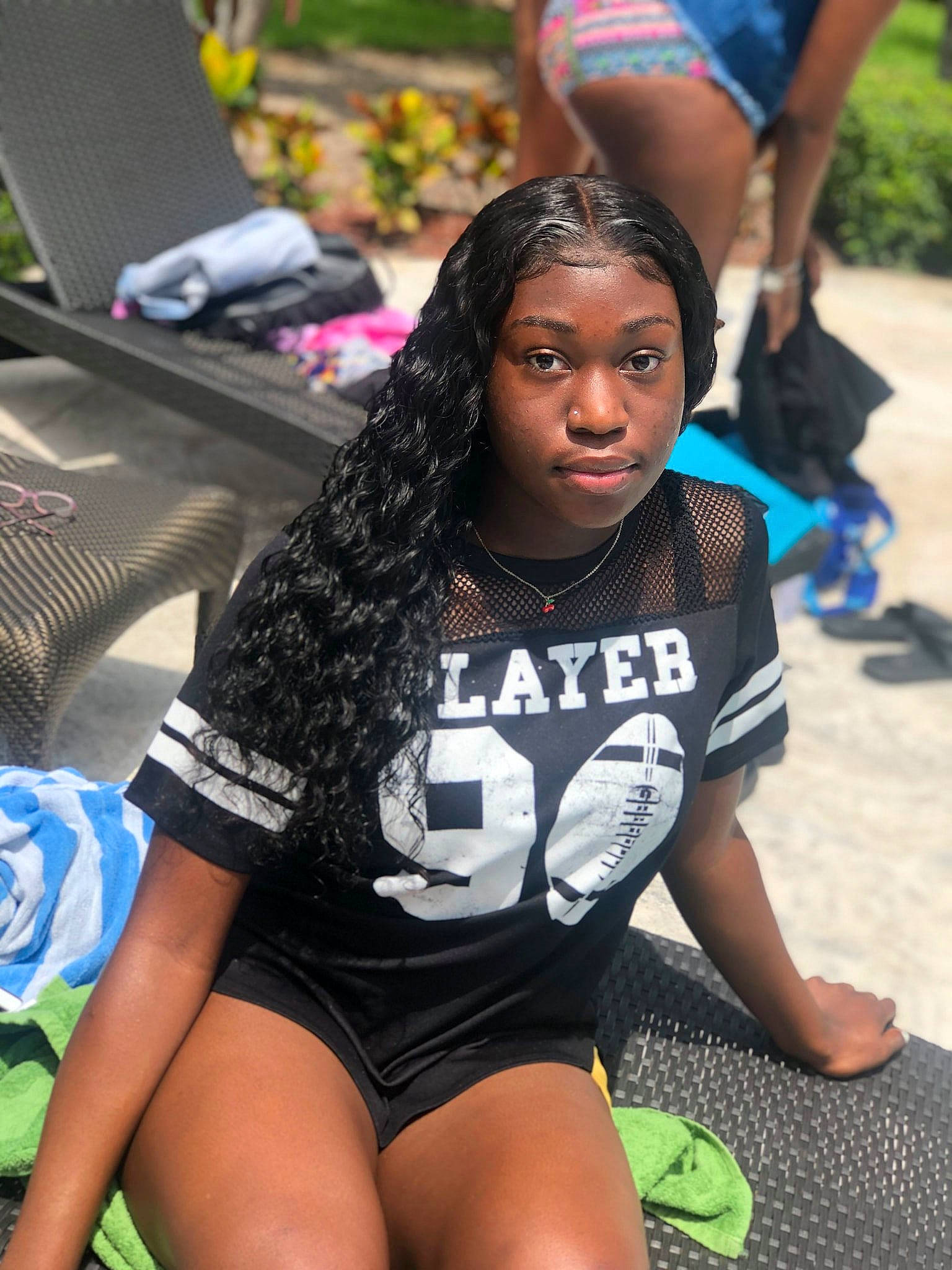 Samariah is registered to the contest to win money with this photo: abdomen, arm, black_hair, human_body, human_leg, joint, knee, leg, leisure, long_hair, person, photo_shoot, photography, physical_fitness, shorts, sitting, style, t_shirt, thigh, trunk