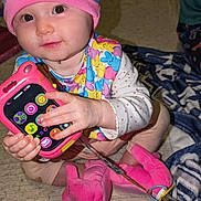 Amelia joined the competition — help win amazing prizes! baby, beanie, bodypart, bonnet, boy, cap, child, clothing, electronics, face, finger, hand, hat, head, male, mobilephone, person, phone, photography, portrait