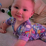 Isabella is registered to the contest to win money with this photo: baby, child, pajamas, crawling, carpet, drool, smiling, face, skin, person, background, indoor, clothing, hand, arm, head, eyes, happy, home, colorful