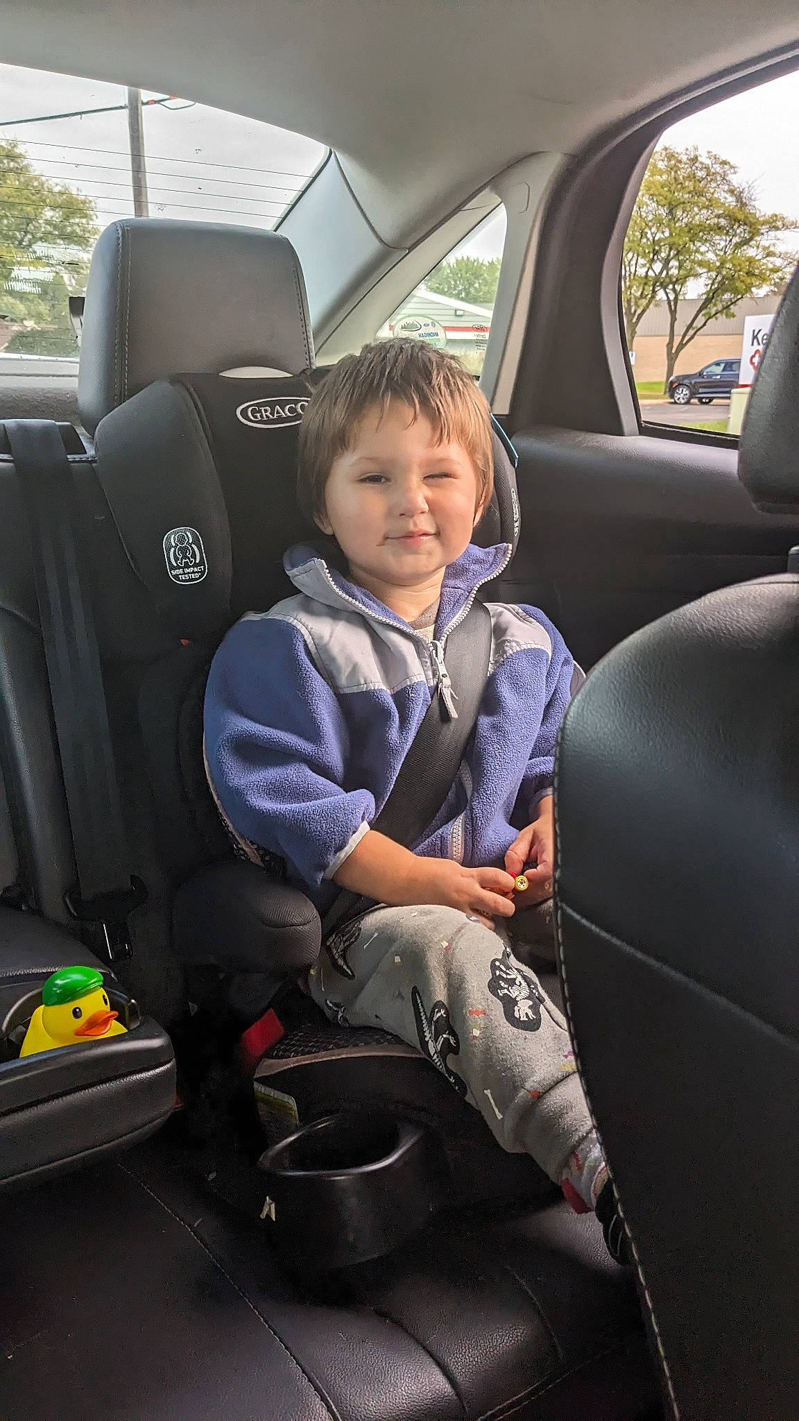 Elijah is registered to the contest to win money with this photo: auto_part, automotive_design, automotive_exterior, car, car_seat, car_seat_cover, comfort, family_car, head_restraint, joy, mode_of_transport, motor_vehicle, person, personal_luxury_car, plant, seat_belt, smile, steering_part, toddler, vehicle