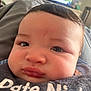 Malachi joined the competition — help win amazing prizes! baby, close_up, face, chubby_cheeks, bib, clothing, indoor, person, portrait, cute, infant, child, soft_surface, television, blurred_background, expression, young, skin, head, eyebrows