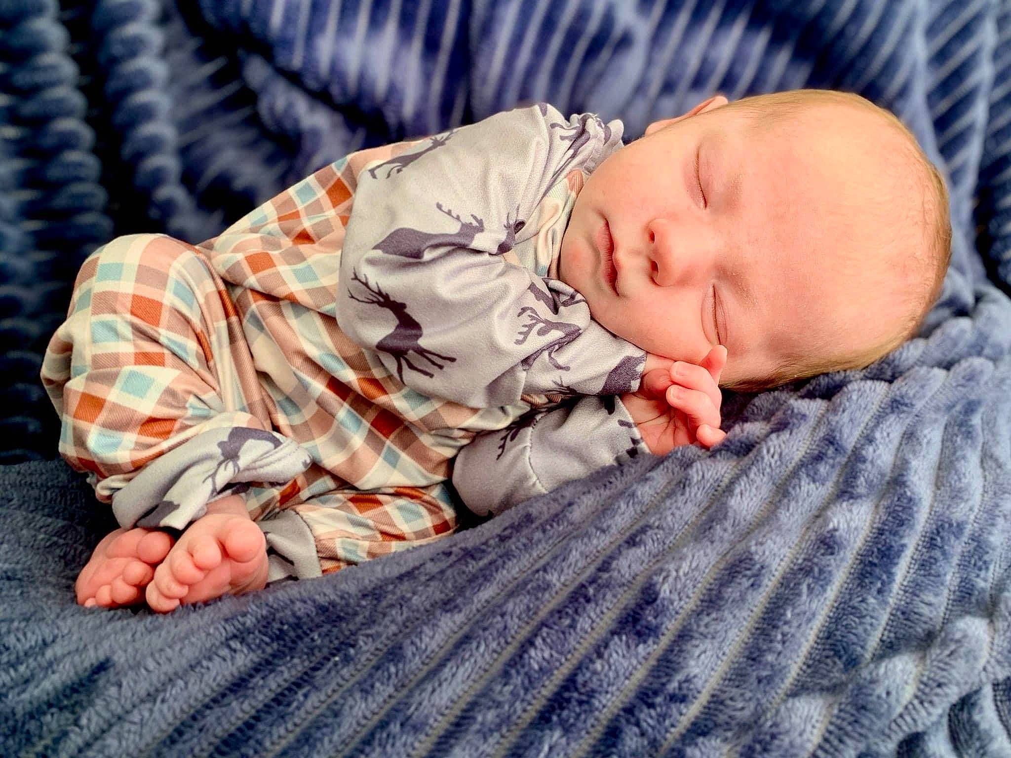 Drake is registered to the contest to win money with this photo: baby, baby_products, baby_sleeping, baby_toddler_clothing, bedtime, cheek, child, comfort, head, linens, nap, orange, pattern, person, portrait_photography, sitting, skin, sleep, sleeve, toddler