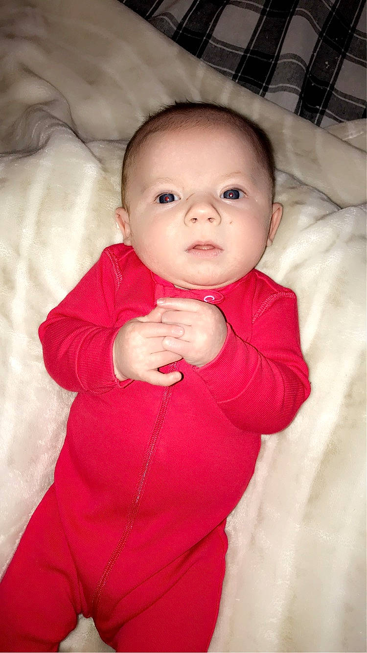 Drake is registered to the contest to win money with this photo: arm, baby, baby_toddler_clothing, cheek, comfort, eye, eyebrow, finger, flash_photography, gesture, happy, head, iris, lip, mouth, nose, person, pink, skin, sleeve