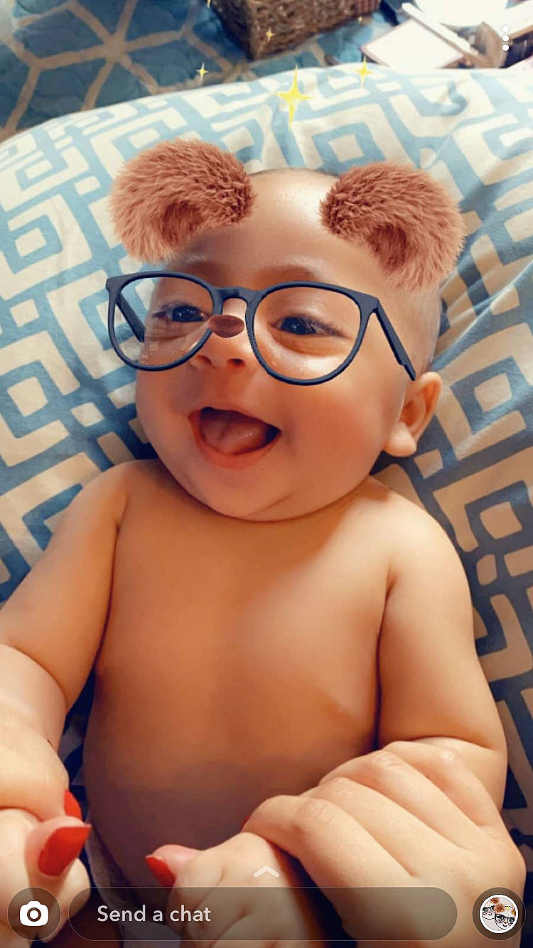 Aaron James is registered to the contest to win money with this photo: baby, cheek, child, ear, eyewear, facial_expression, forehead, glasses, headwear, nose, person, skin, smile, toddler