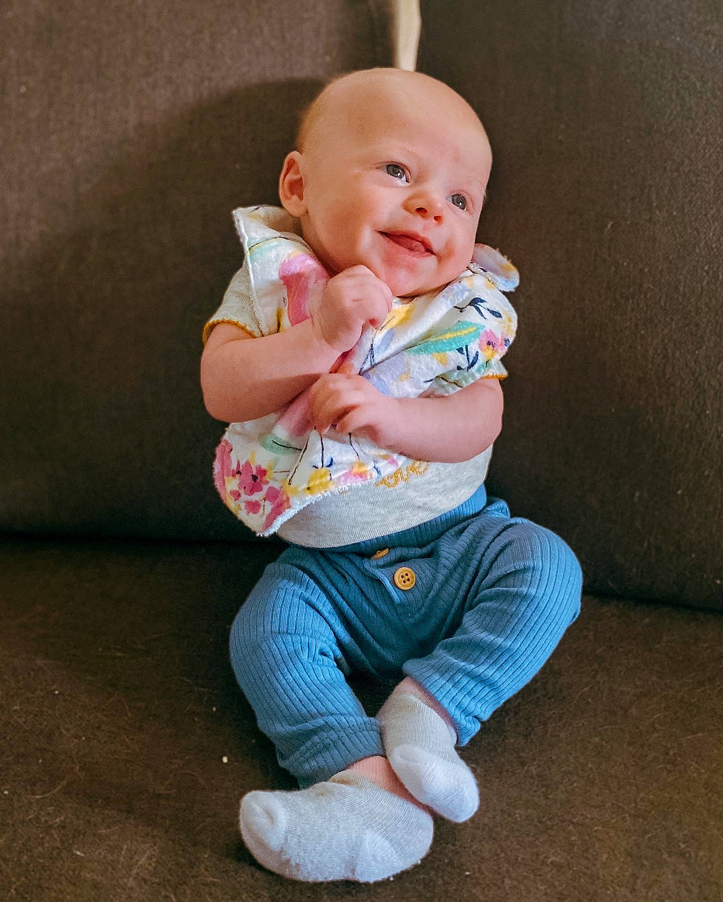 Lylah is registered to the contest to win money with this photo: baby, baby_toddler_clothing, cheek, comfort, eye, face, flash_photography, gesture, happy, head, iris, knee, leg, lip, nose, person, skin, sleeve, smile, t_shirt