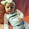 Myla joined the competition — help win amazing prizes! baby, infant, headband, bow, pink_blanket, white_top, floral_pants, soft_texture, curious_expression, cute, child, portrait, laying_down, indoors, cozy, young_child, person, clothing, close_up, baby_girl
