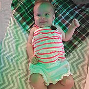 Myla joined the competition — help win amazing prizes! baby, child, smile, striped_clothing, blanket, pattern, cheerful, infant, lying_down, soft_toys, cozy, cute, happy, small_hands, small_feet, indoor, fabric, plaid, zigzag_pattern, casual