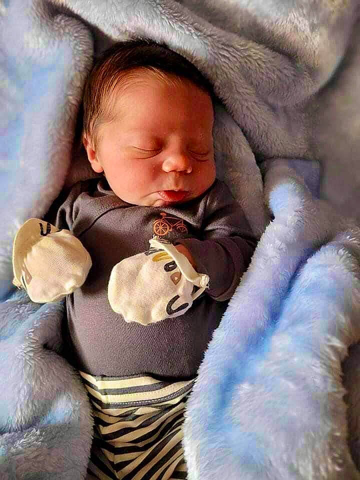 Zacheriah is registered to the contest to win money with this photo: baby, baby_products, baby_sleeping, baby_toddler_clothing, cheek, child, comfort, eye, face, finger, happy, iris, linens, mammal, mouth, nose, person, sitting, skin, textile