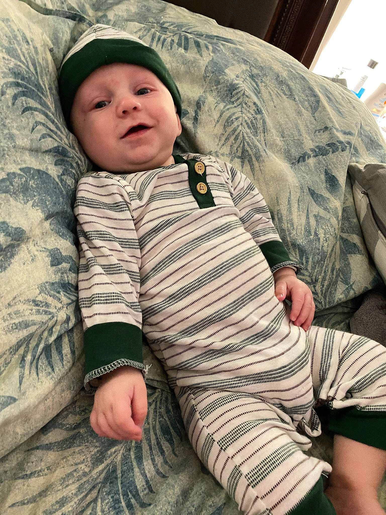 Ashtyn joined the competition — help win amazing prizes! baby, baby_sleeping, baby_toddler_clothing, camouflage, child, comfort, fur, grass, headgear, headwear, human_leg, linens, military_camouflage, pattern, person, sitting, skin, sleep, sleeve, thigh