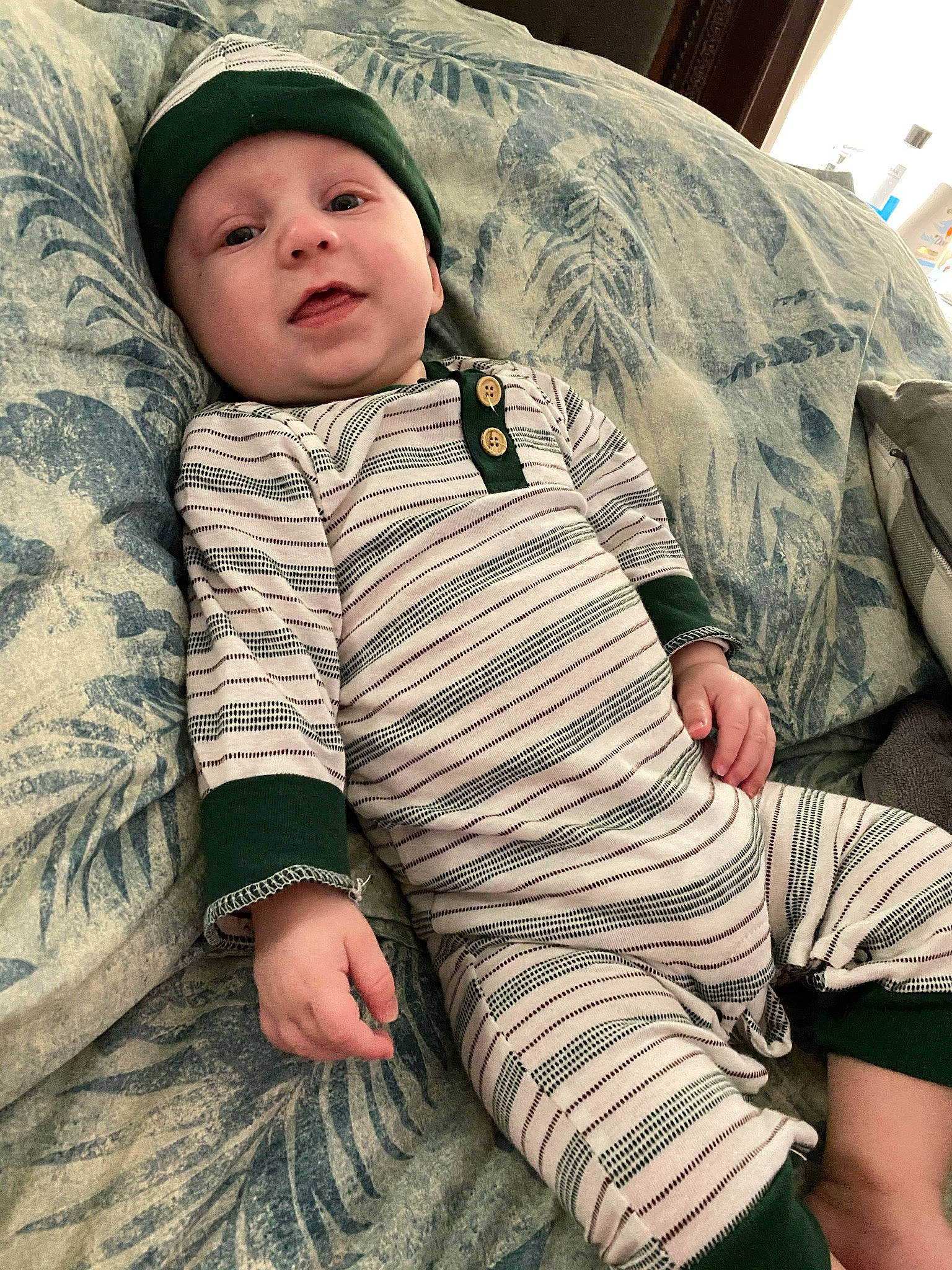 Ashtyn joined the competition — help win amazing prizes! baby, baby_toddler_clothing, comfort, cool, eye, face, fun, grass, happy, head, headgear, headwear, human_leg, linens, military_camouflage, pattern, person, photograph, sitting, skin