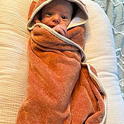 Sutton joined the competition — help win amazing prizes! baby, infant, towel, hood, wrapped, cushion, blanket, soft, cozy, face, eyes, hand, newborn, cute, portrait, indoors, resting, child, person, warm
