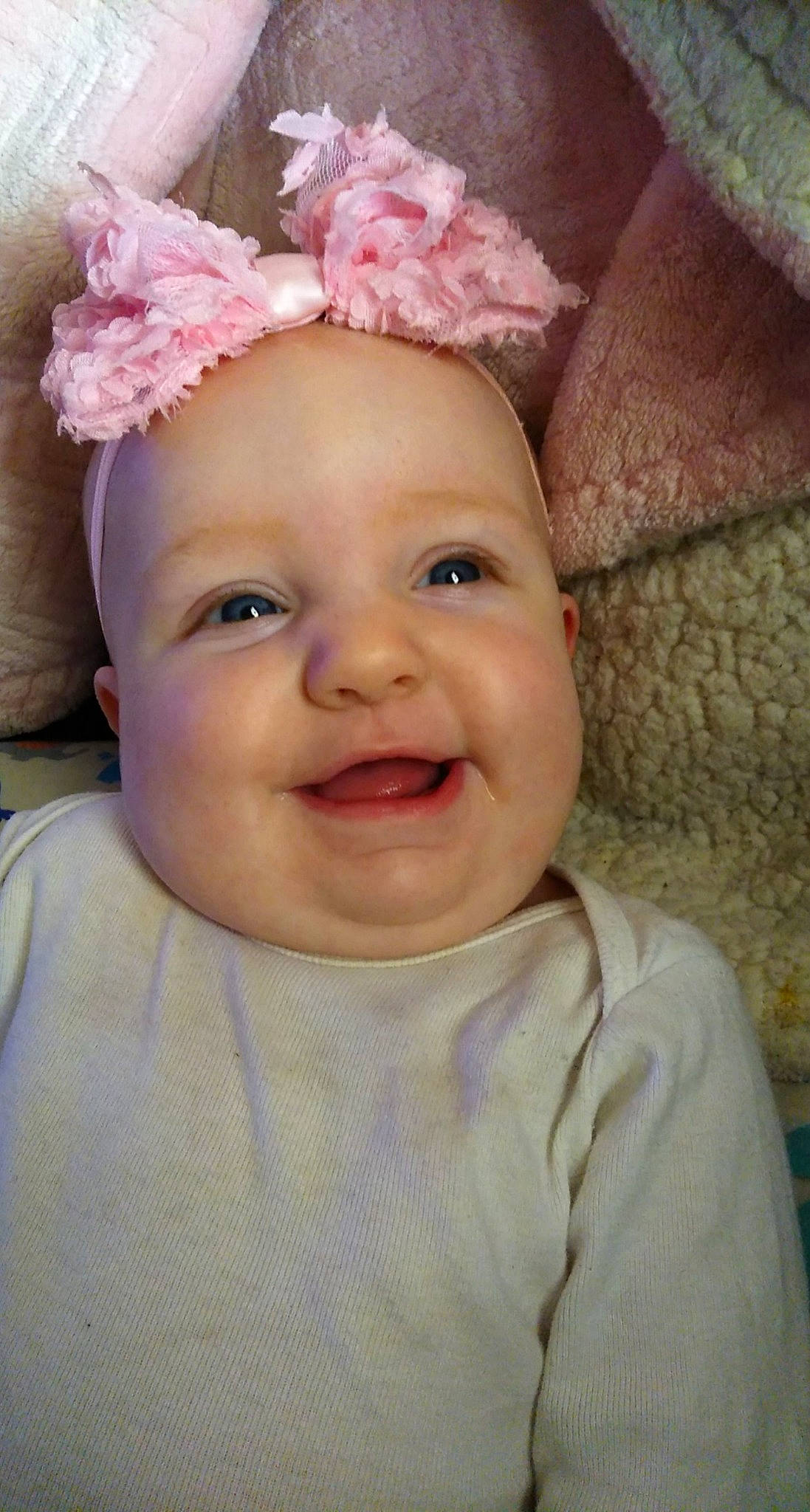 Annaliese is registered to the contest to win money with this photo: baby, baby_making_funny_faces, cheek, child, chin, ear, eye, face, facial_expression, forehead, hair_accessory, head, headgear, headwear, iris, lip, nose, person, pink, skin