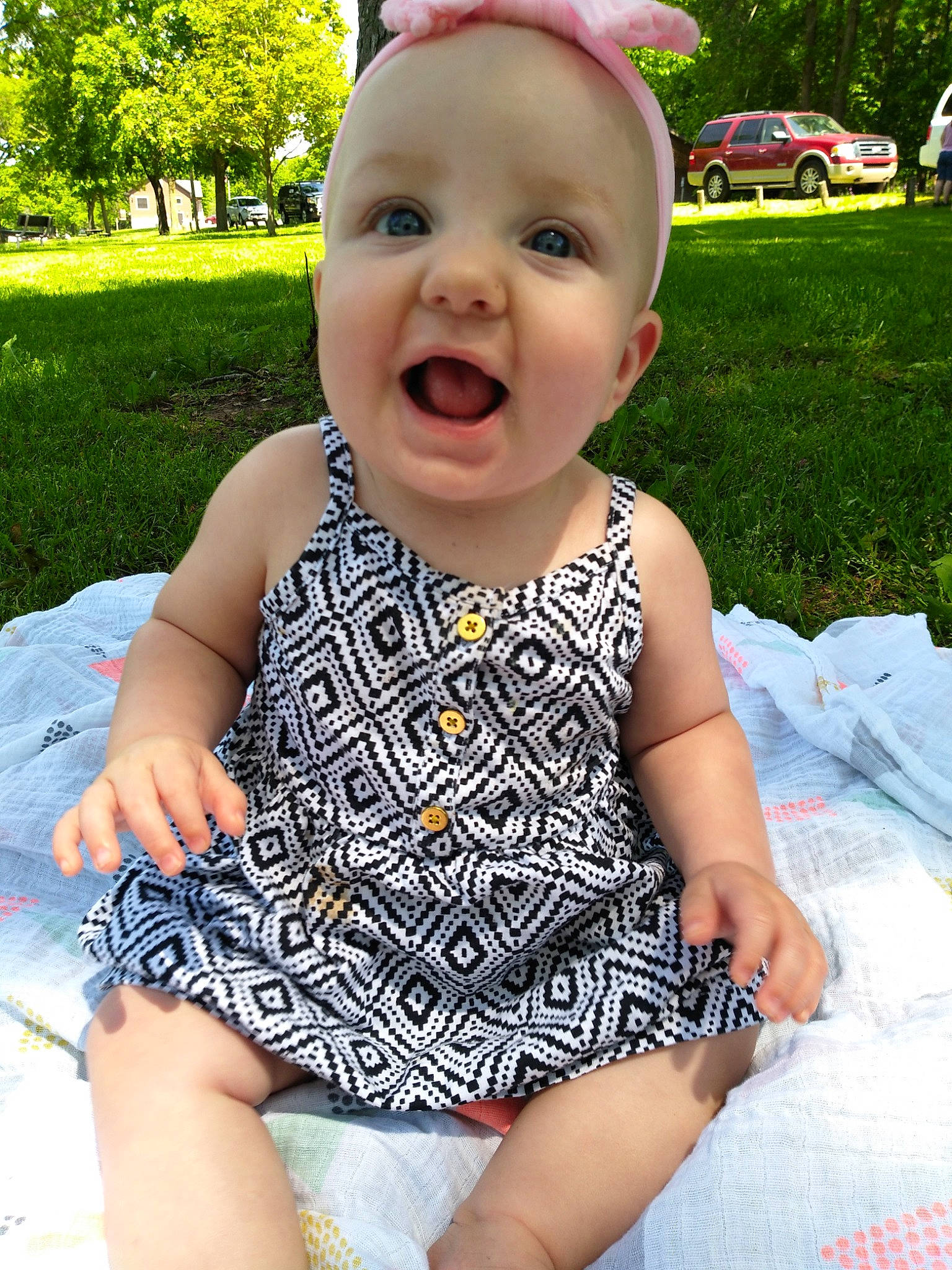 Annaliese joined the competition — help win amazing prizes! baby, baby_products, baby_toddler_clothing, child, dress, face, fashion_accessory, grass, happy, head, headgear, lip, person, plant, product, recreation, skin, smile, summer, toddler