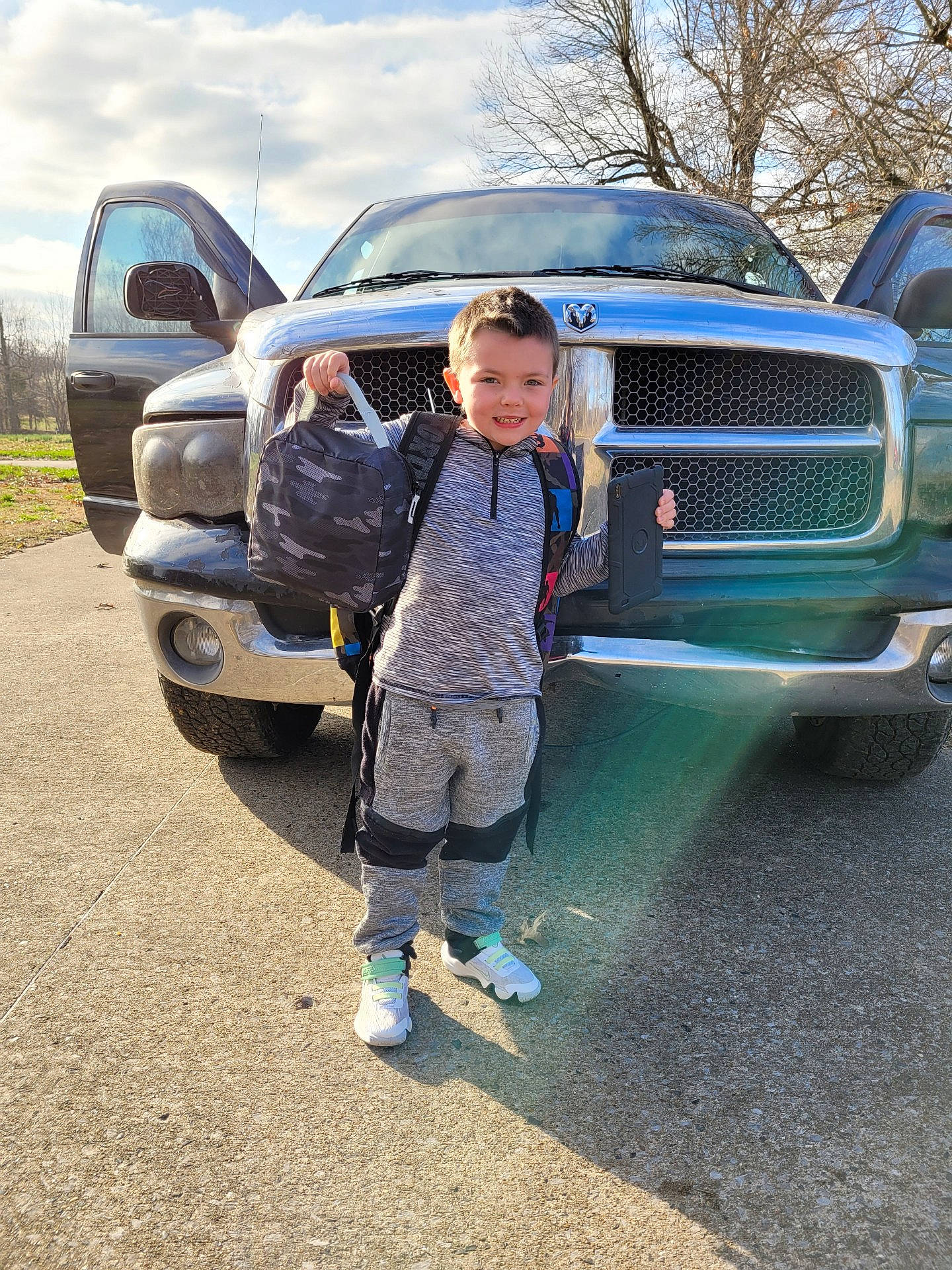 Ryder joined the competition — help win amazing prizes! automotive_design, automotive_lighting, automotive_tire, bumper, car, footwear, grille, hood, jeans, joy, land_vehicle, leg, motor_vehicle, person, plant, rim, shoe, tire, tree, vehicle