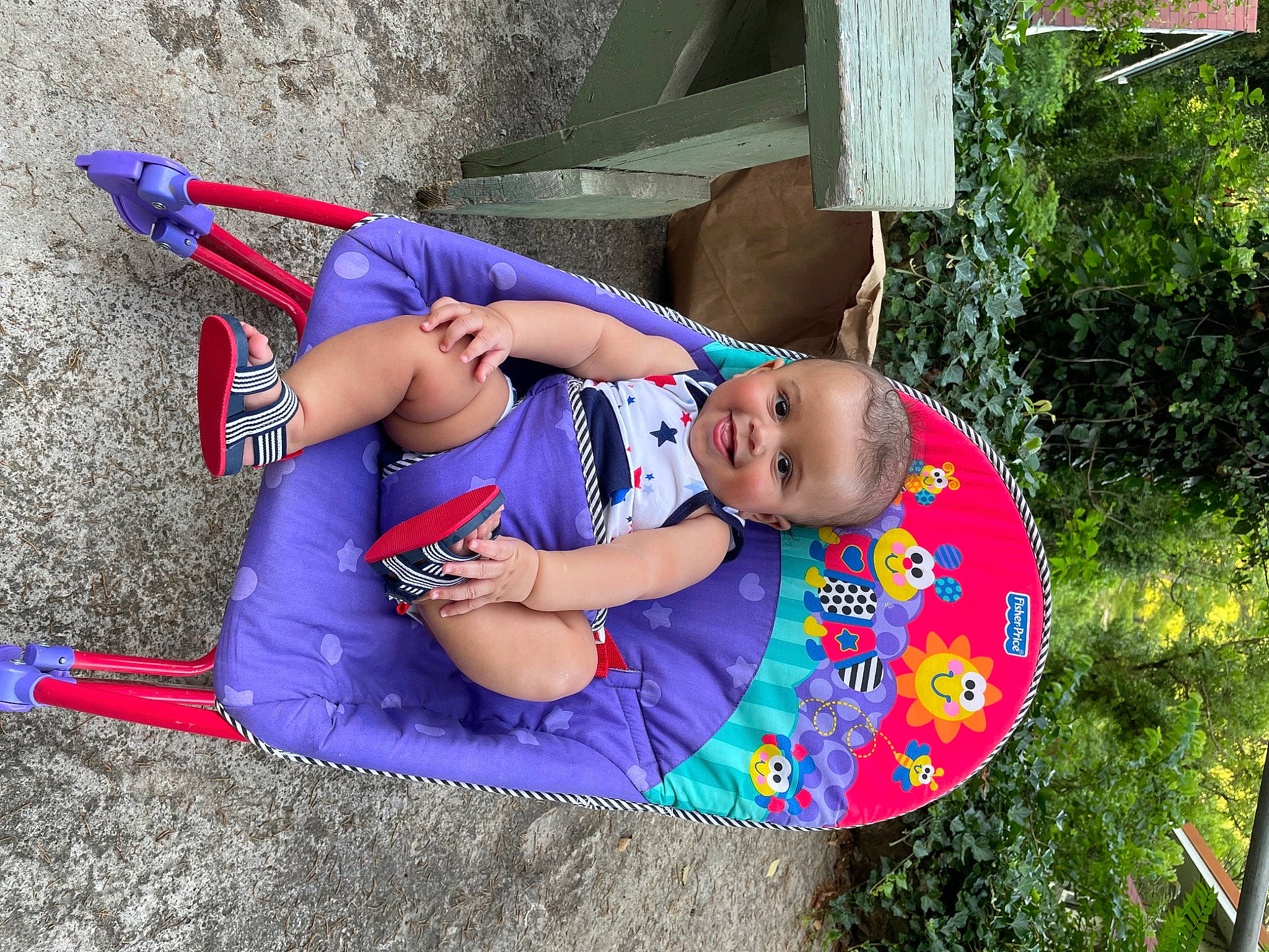 Desmond is registered to the contest to win money with this photo: baby_toddler_clothing, child, clothing, electric_blue, fun, grass, happy, hat, joy, leisure, magenta, person, pink, plant, play, product, recreation, shorts, sitting, t_shirt