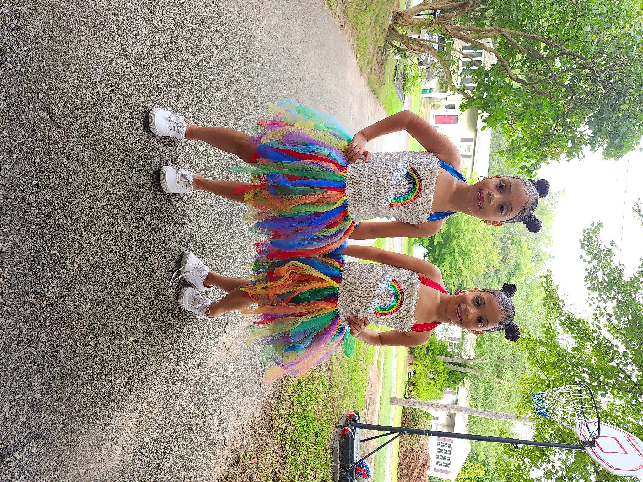 Nyeema And Natalia is registered to the contest to win money with this photo: arm, asphalt, child, concrete, fun, grass, happy, human_leg, joy, leisure, people_in_nature, person, plant, recreation, shadow, shorts, thigh, tree