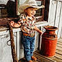 Wilder joined the competition — help win amazing prizes! child, toddler, cowboy_hat, western_shirt, jeans, boots, belt, porch, wooden_floor, milk_can, window, reflection, rustic, smiling, outdoor, old_tool, vintage, person, standing, hat