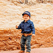 Wilder joined the competition — help win amazing prizes! child, toddler, boy, cowboy, hat, cap, denim_shirt, belt, jeans, boots, smiling, standing, outdoor, brick_floor, rustic_wall, portrait, happy, fashion, casual, young_child