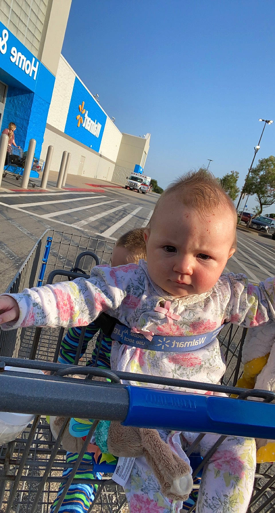 Amelia joined the competition — help win amazing prizes! baby, baby_products, baby_toddler_clothing, blue, building, child, city, fun, leisure, outdoor_furniture, person, recreation, sitting, sky, toddler, tourism, travel, tree, vacation, window