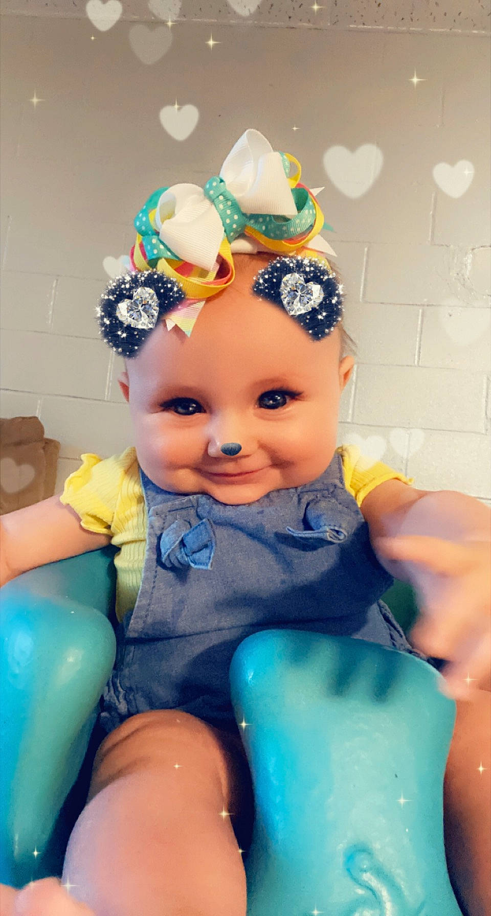 Amelia is registered to the contest to win money with this photo: art, azure, blue, cap, child, doll, electric_blue, eye, fashion_accessory, fun, hair_accessory, happy, head, headpiece, jewellery, party_supply, person, plastic, purple, sitting