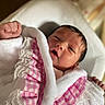 Waïlee a rejoint le concours — aidez-le/la à gagner de superbes lots ! newborn, baby, infant, blanket, pink, lace, clothing, wrapped, sleepy, cute, portrait, indoor, soft_light, bed, hand, face, fingers, person, closeup, cozy