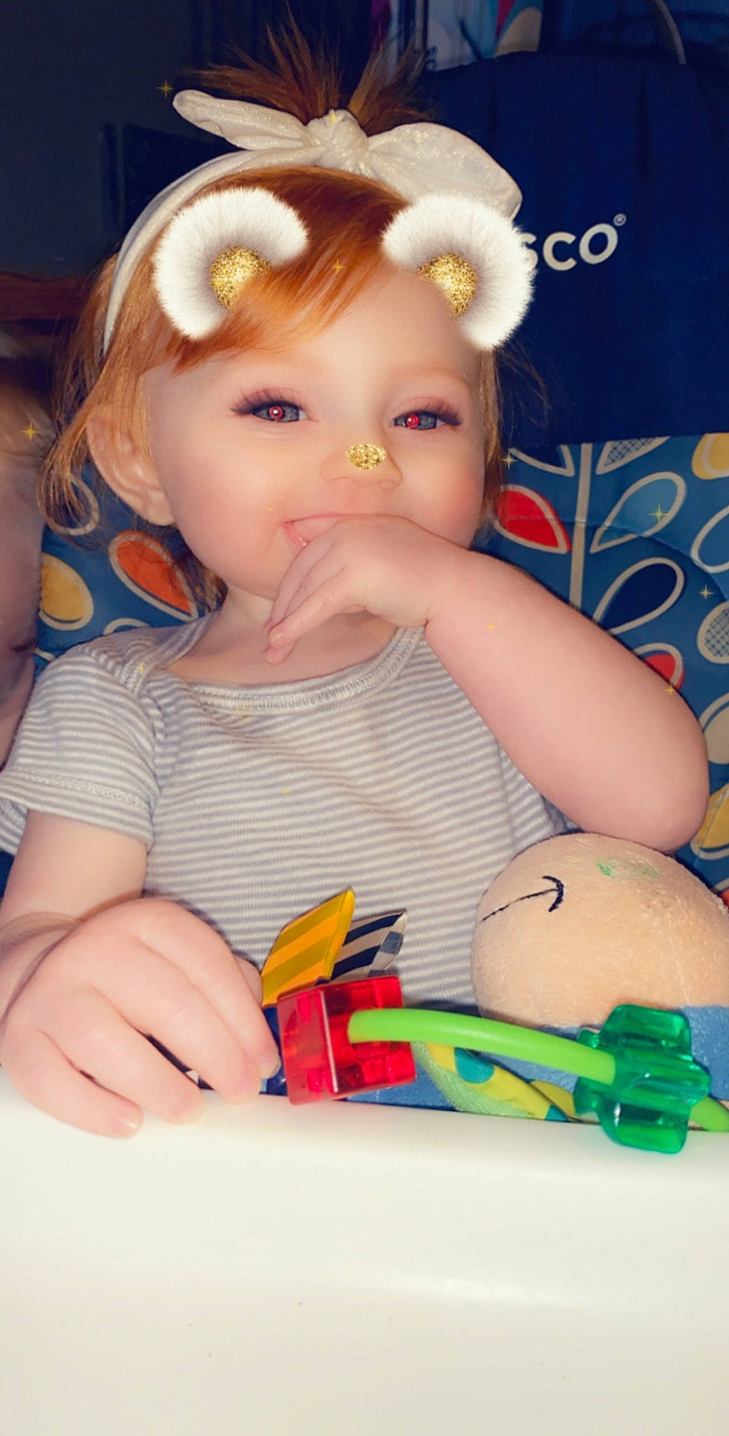 Issabella is registered to the contest to win money with this photo: arm, baby, brown_hair, cheek, child, ear, eye, eyelash, finger, forehead, hair, hand, head, lip, mouth, nose, person, play, skin, toddler